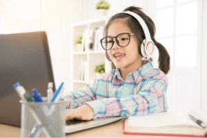 Child learning online using laptop at home