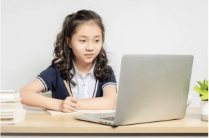 Girl learning through laptop- Connected Learning