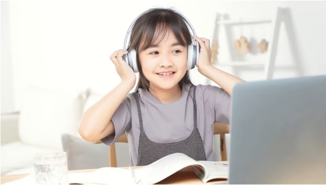 young girl watching and learning skills