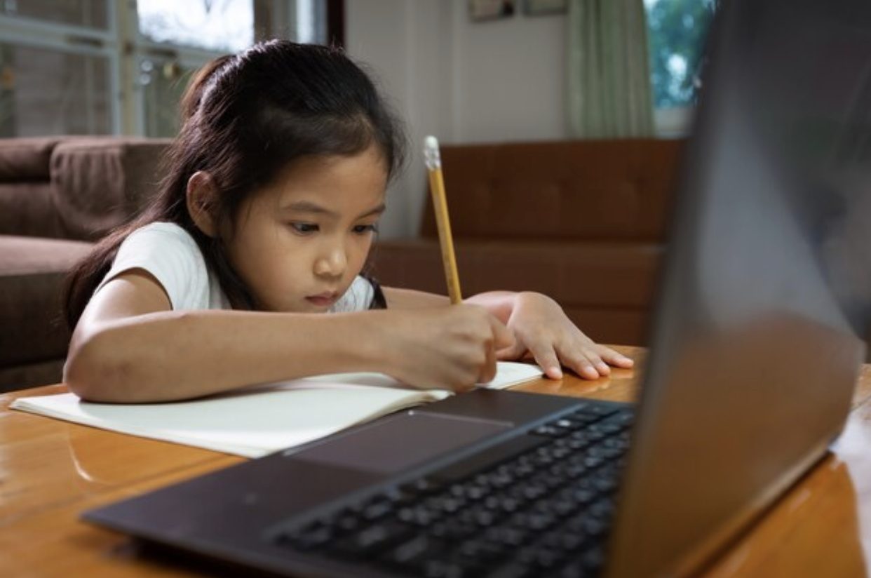 Learner practicing writing skills during class