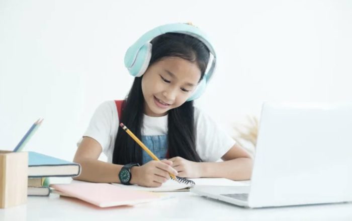Child using headphones for interactive language learning